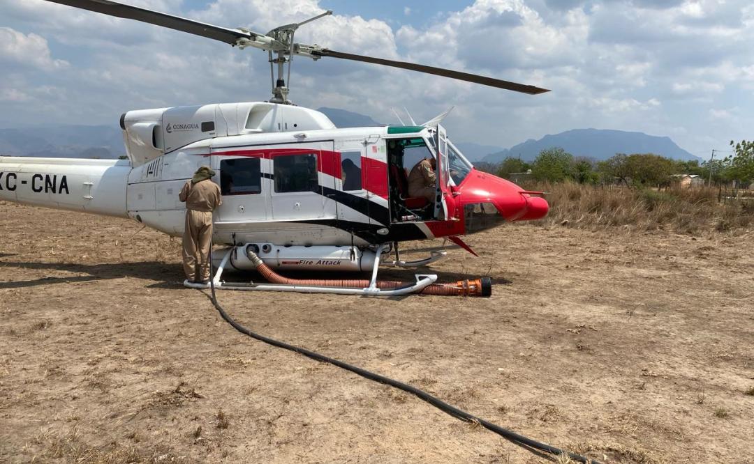 Con helicóptero de Conagua, combaten en Oaxaca incendio selva de Los Chimalapas