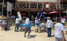¡480 por dos cervezas en Huatulco! Tras cobros excesivos, desalojan sombrillas de restaurantes a orilla de playa