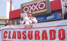Con clausura simbólica de OXXO, protestan en Oaxaca por amparos contra leyes antichatarra y antidesechables 